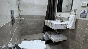 Luxury Suite, City View | Bathroom | Separate tub and shower, hair dryer, bidet, towels