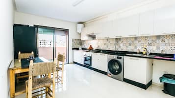 Family Apartment, Balcony, City View | Private kitchen | Fridge, oven, stovetop, cookware/dishes/utensils