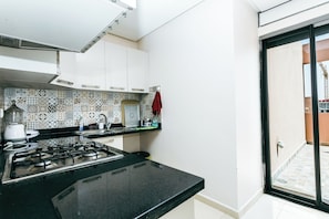 Deluxe Apartment, Balcony | Private kitchen