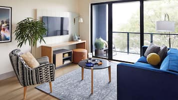 Apartment, 1 Bedroom | Living area | 55-inch Smart TV with cable channels
