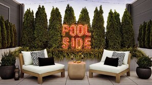 Outdoor pool, open 8:00 AM to 10:00 PM, free pool cabanas