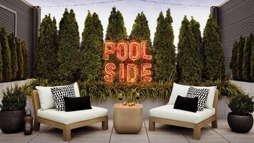 Outdoor pool, open 8:00 AM to 10:00 PM, free cabanas, pool umbrellas