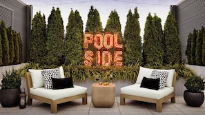 Outdoor pool, open 8:00 AM to 10:00 PM, free pool cabanas