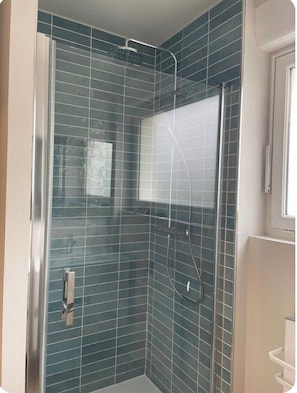 Shower, hair dryer, towels, soap