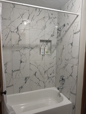 Shower, towels, soap, toilet paper