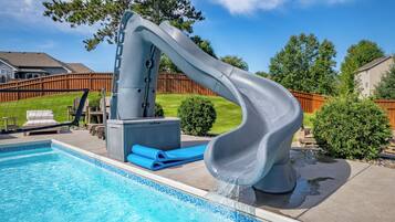 Make a splash on the curving water slide into the sparkling in-ground pool.