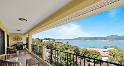 Remodeled Top-Floor Condo with Stunning Wrap-Around Balcony Offering Mountain, Ocean & Marina Views