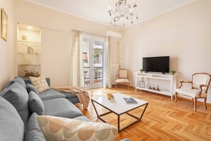 Family Apartment, 2 Bedrooms, Balcony | Living area | 40-inch TV with digital channels