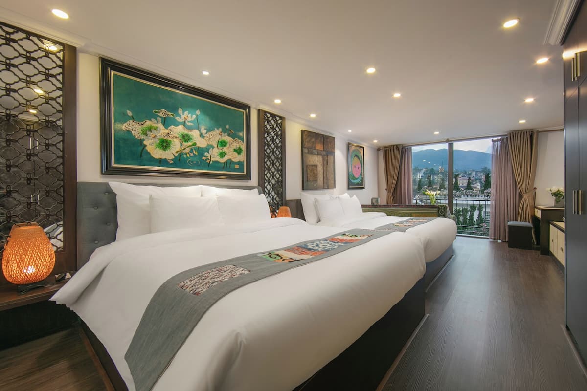 Deluxe Quadruple Room, Balcony | In-room safe, desk, laptop workspace, soundproofing