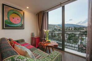 Deluxe Quadruple Room, Balcony | In-room safe, desk, laptop workspace, soundproofing - Quiet Sapa Hotel (Sa Pa)