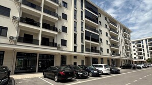 A multi-story parking garage with several cars parked in designated spaces.