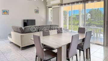 Family Villa, Balcony, Garden View | Living area | 60-inch LED TV with cable channels, Netflix, streaming services
