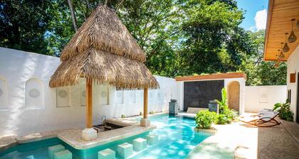 Bohemian Tropical Villa with a Tiki-Style Swimming Pool & Swim-Up Bar with an Attached Studio Apartment