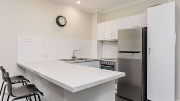 Microwave, stovetop, dishwasher, cookware/dishes/utensils