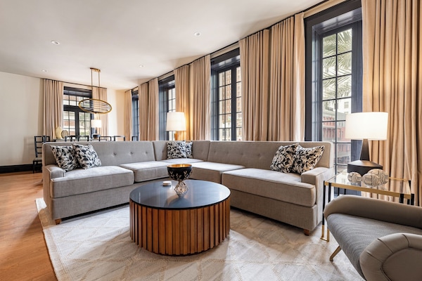 3BR City Views: Walk to French Qtr | The Mayfair | Living area | 65-inch Smart TV with cable channels, Netflix, Hulu