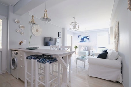 Family Apartment, 1 Bedroom, Balcony | Living area | 40-inch TV with digital channels