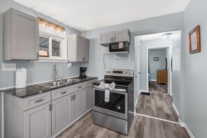 Fridge, microwave, stovetop, coffee/tea maker