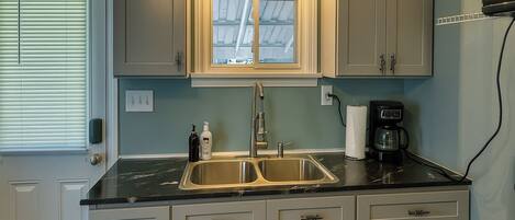 Fridge, microwave, stovetop, coffee/tea maker