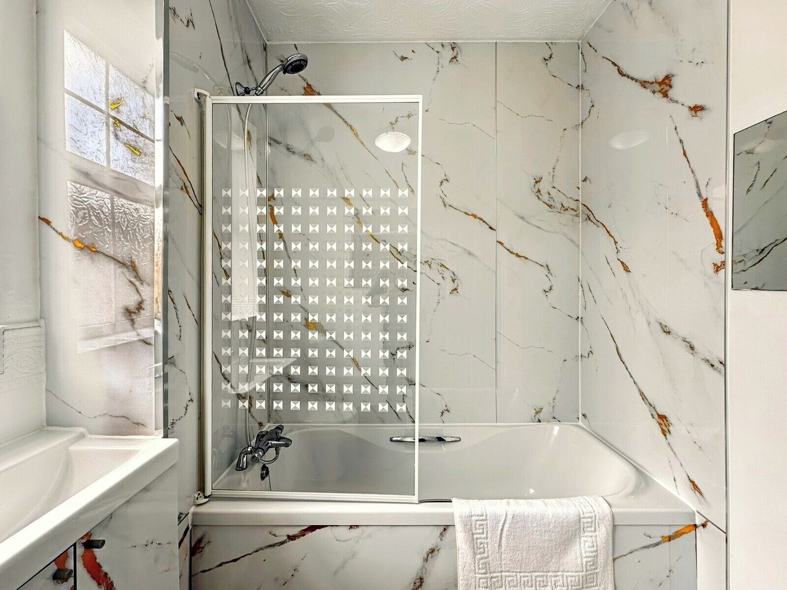 Combined shower/bathtub, deep-soaking bathtub, hair dryer, towels