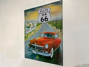 A vintage Route 66 diner sign and a classic car on a road. - Oakwood House 6 Bed 11 Sleeps Garden-free Parking (Leicester)