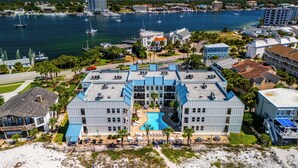 A resort with a pool, beachfront, and marina views. - Coastal Paradise on Holiday Isle - Quiet place, snorkeling cove! Gated Parking! (Destin)