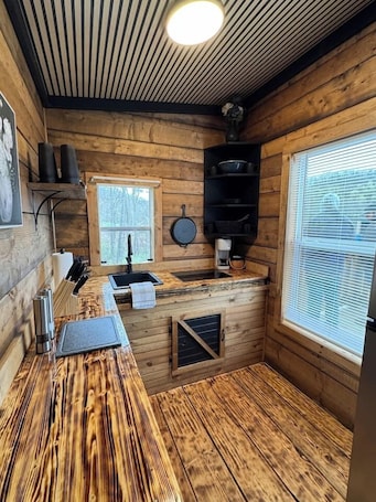 Fridge, microwave, stovetop, coffee/tea maker. Glenville’s Rustic Charm