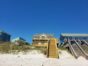 Enjoy stunning ocean views from the balcony of this spacious two-story house.