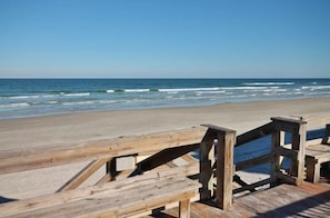 Walk along the boardwalk to the wide, open beach.