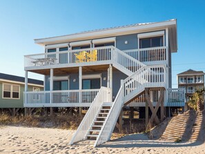 Enjoy stunning ocean views from the elevated balcony, where multiple levels offer a seamless connection to the beach.