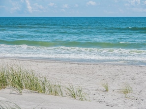 A beach with clear blue water and white sand. - Sea Ya Beaches by Topsail Realty (Holly Ridge)