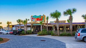 A building with a colorful sign reading "Surf Hut."