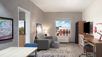 Suite, 1 Bedroom | Desk, blackout drapes, iron/ironing board, free WiFi