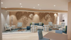 Un interior moderno con una pared de madera con diseño de hojas, una mesa redonda y diversas opciones de asientos.