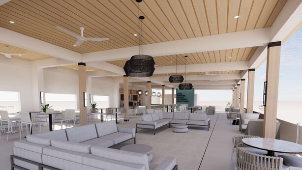 Amplia sala de estar moderna con un sofá modular grande, mesas redondas y un techo de vigas de madera con iluminación empotrada.