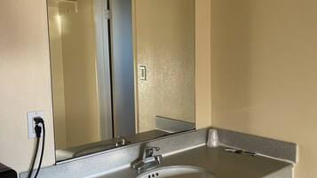 Habitación individual Deluxe | Baño | Jabón, shampoo, papel de baño