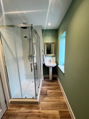 Shower, eco-friendly toiletries, hair dryer, towels