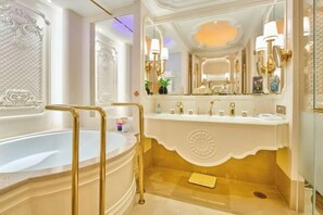 A luxurious bathroom with a large bathtub, a separate shower area, and a vanity with a mirror. - Hangzhou Platinum Hanjue Hotel (Hangzhou)
