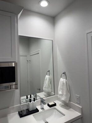 Shower, towels, soap, toilet paper