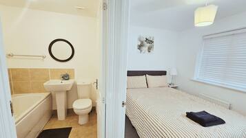 Shower, jetted bath, towels, soap