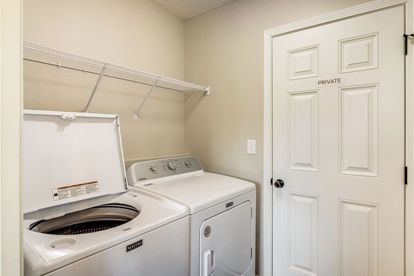 A laundry room with a washing machine, dryer, and a clothes drying rack. - Deck & Outdoor Dining: Family Getaway in Dry Ridge (Dry Ridge)