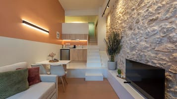 Departamento Confort, 1 habitación, para no fumadores, cocineta | Área de sala de estar | Smart TV de 32 pulgadas con canales por cable