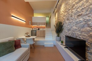 AthenianNest Psyrri Urban Loft Studio | Living area | 32-inch Smart TV with cable channels - AthenianNest (Athens)