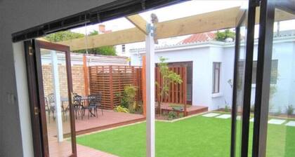 Spacious 4BR En-Suite Home – 5 Min to the Beach & Airport | Free WiFi & Parking