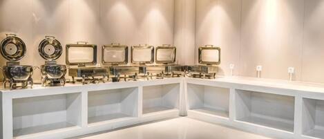 A modern interior with a long counter displaying various decorative items.