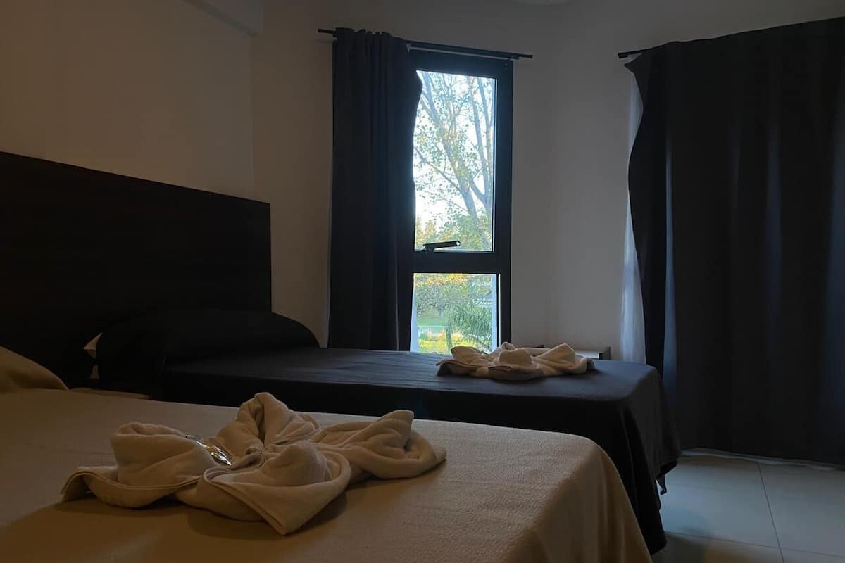 Desk, laptop workspace, free WiFi, bed sheets