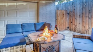 An outdoor patio with a fire pit, seating, and a pizza. - New Remodel! +5 bedroom+Game Room+Sauna+Theater (Denver)