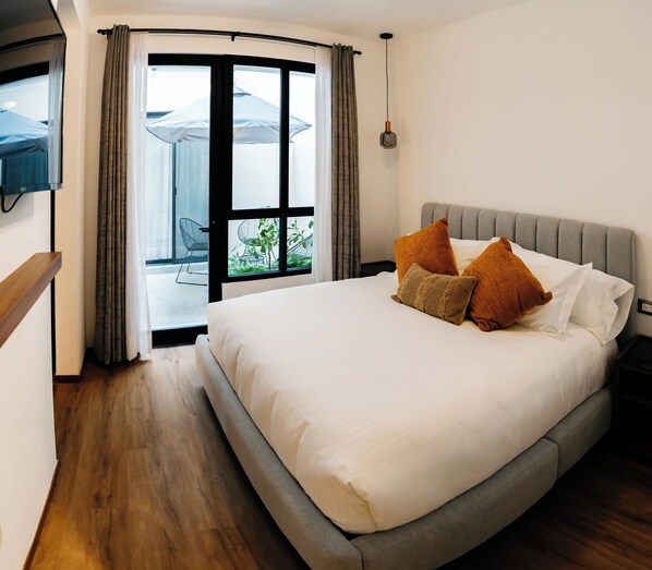 Basic Room, 1 Queen Bed, Shower Grab Bars, Patio | In-room safe, desk, laptop workspace, iron/ironing board