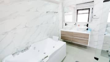 Shower, jetted tub, towels, soap