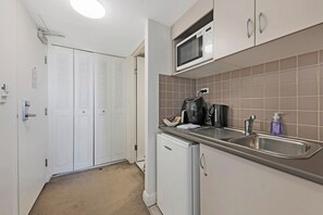 Fridge, microwave, cookware/dishes/utensils