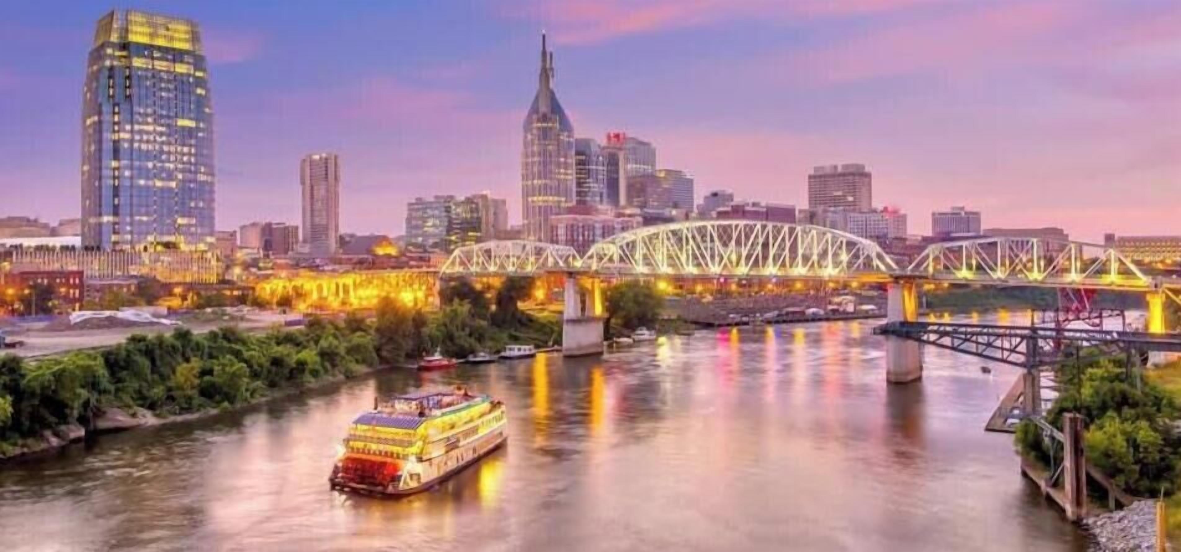 A river with a bridge and a city skyline in the background.
